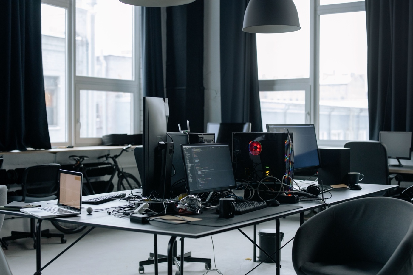 The studio desks, screens still on